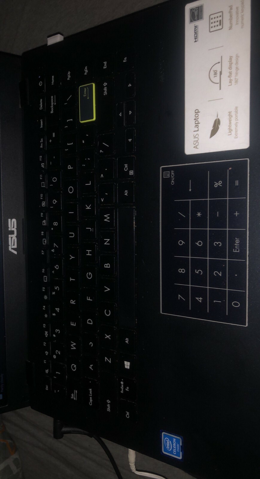 Asus Laptop, 4GB Ram (3.83 GB Usable), 1.10GHz, and E410MA Type. Number Pad.