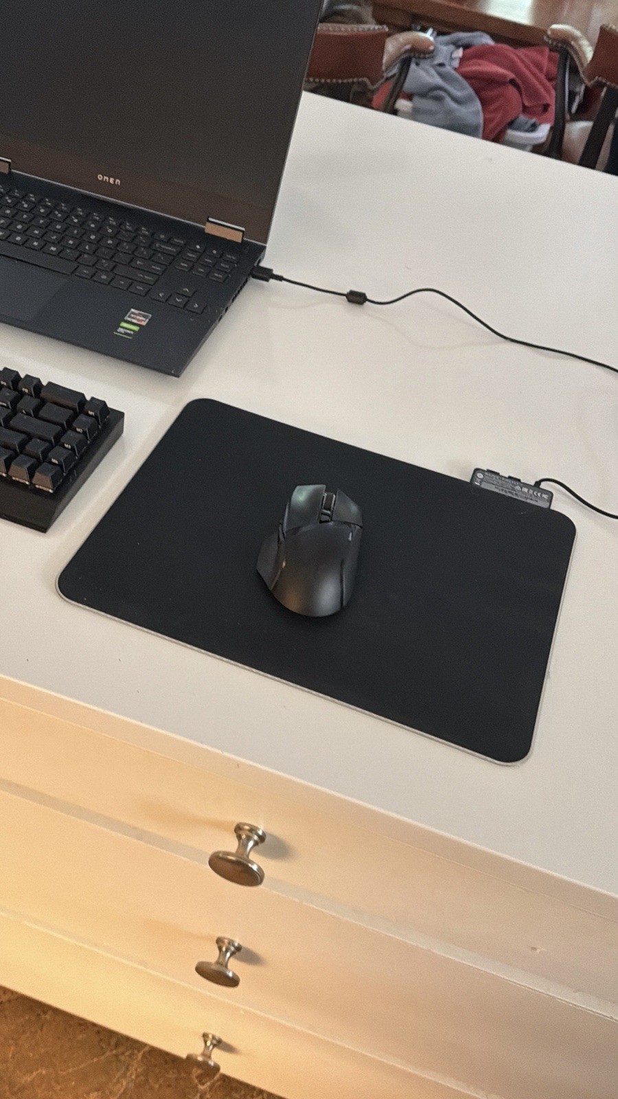 Omen 15 laptop with Razer Mouse, Razer Mousepad, Razer Keyboard, and charger.