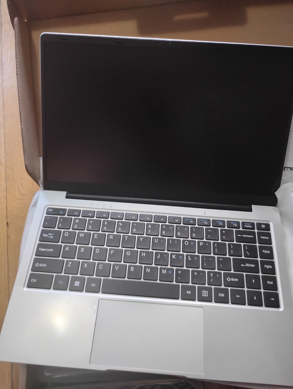 Silver Aussda 14.1″ laptop. NEW. Windows 11. 512 GB, Celeron. LCD screen
