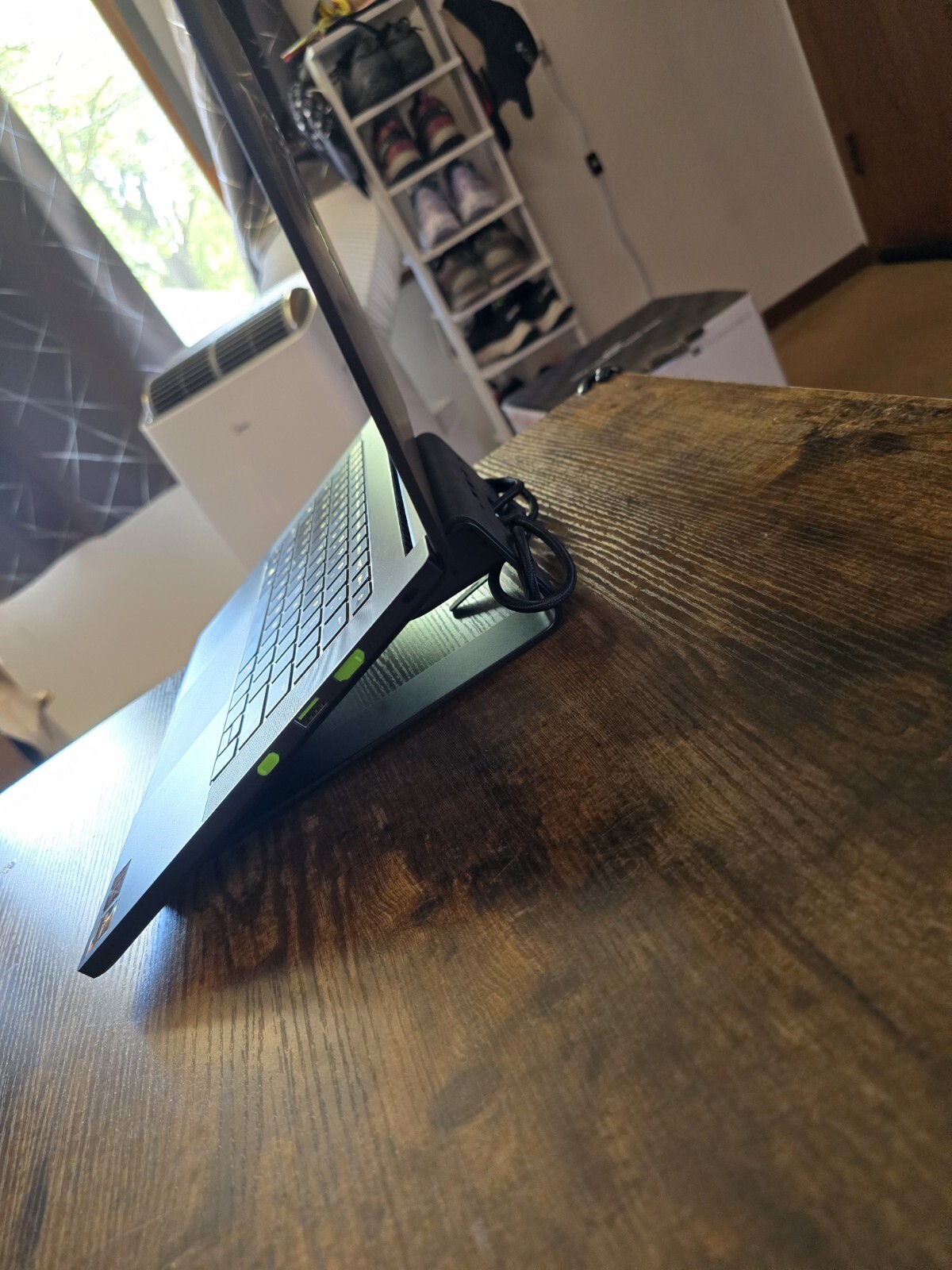 black Razer 14″ Gaming Laptop with razer rgb laptop stand and power supply unit