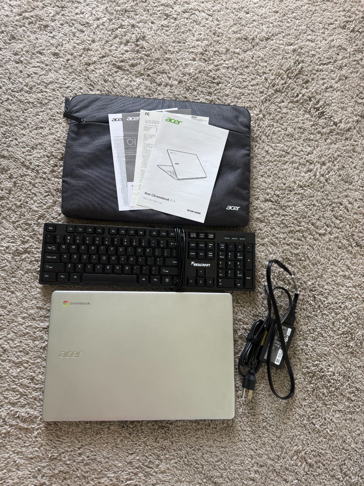 Acer Chromebook 315 with computer sleeve, charger, included a Skilcraft keyboard