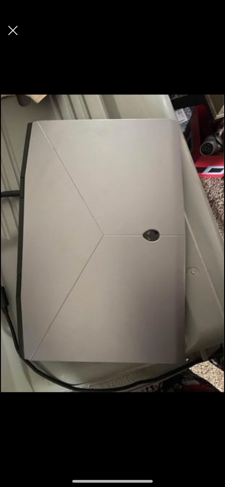Alienware M17 Laptop with charger and backpack.