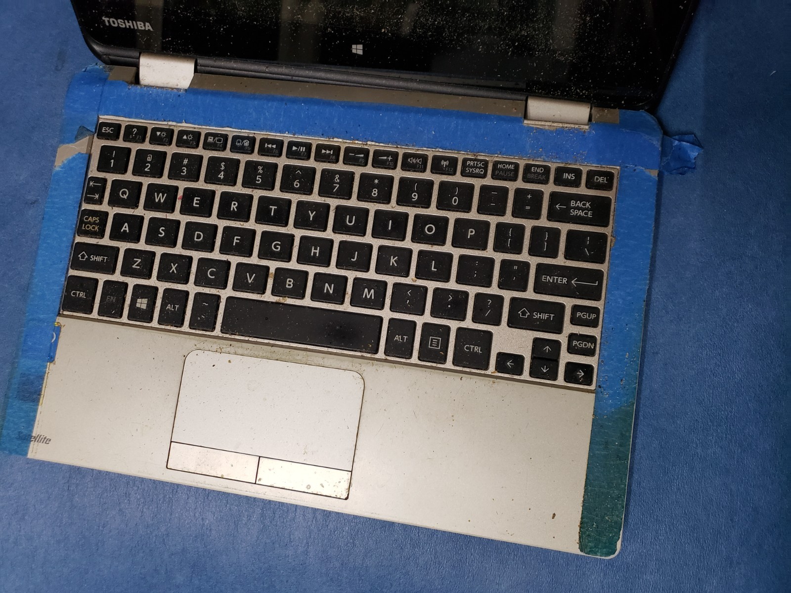 Toshiba Satellite Radius 11 L15W-B1302 Laptop damaged and dirty for parts