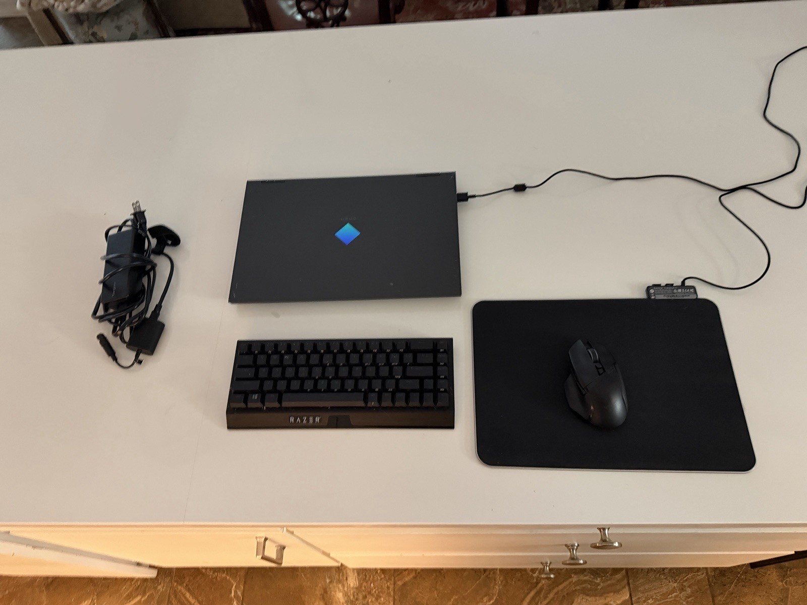Omen 15 laptop with Razer Mouse, Razer Mousepad, Razer Keyboard, and charger.