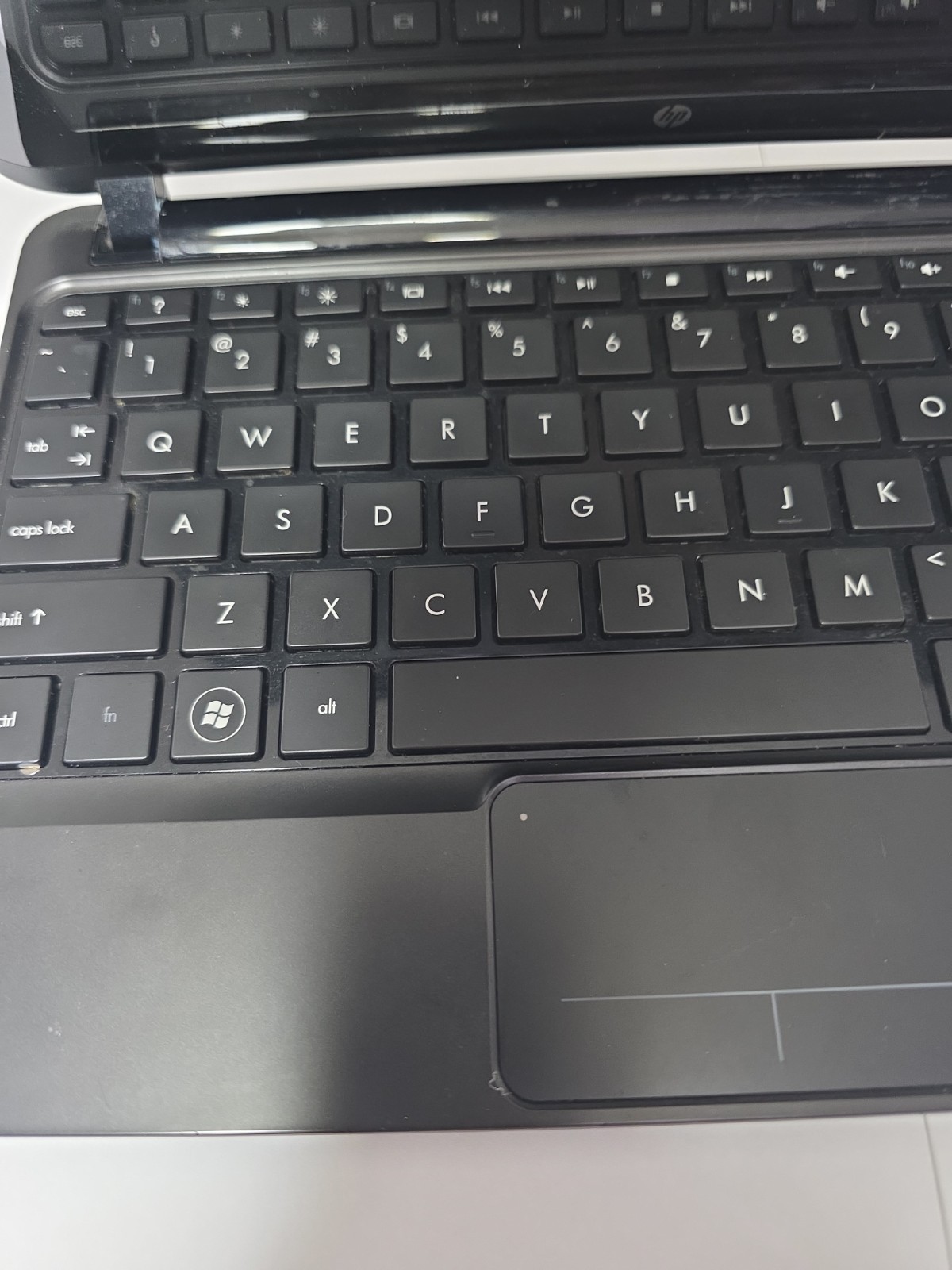 Functional HP Mini laptop. Has scratches and scuffs on screen. For Parts.