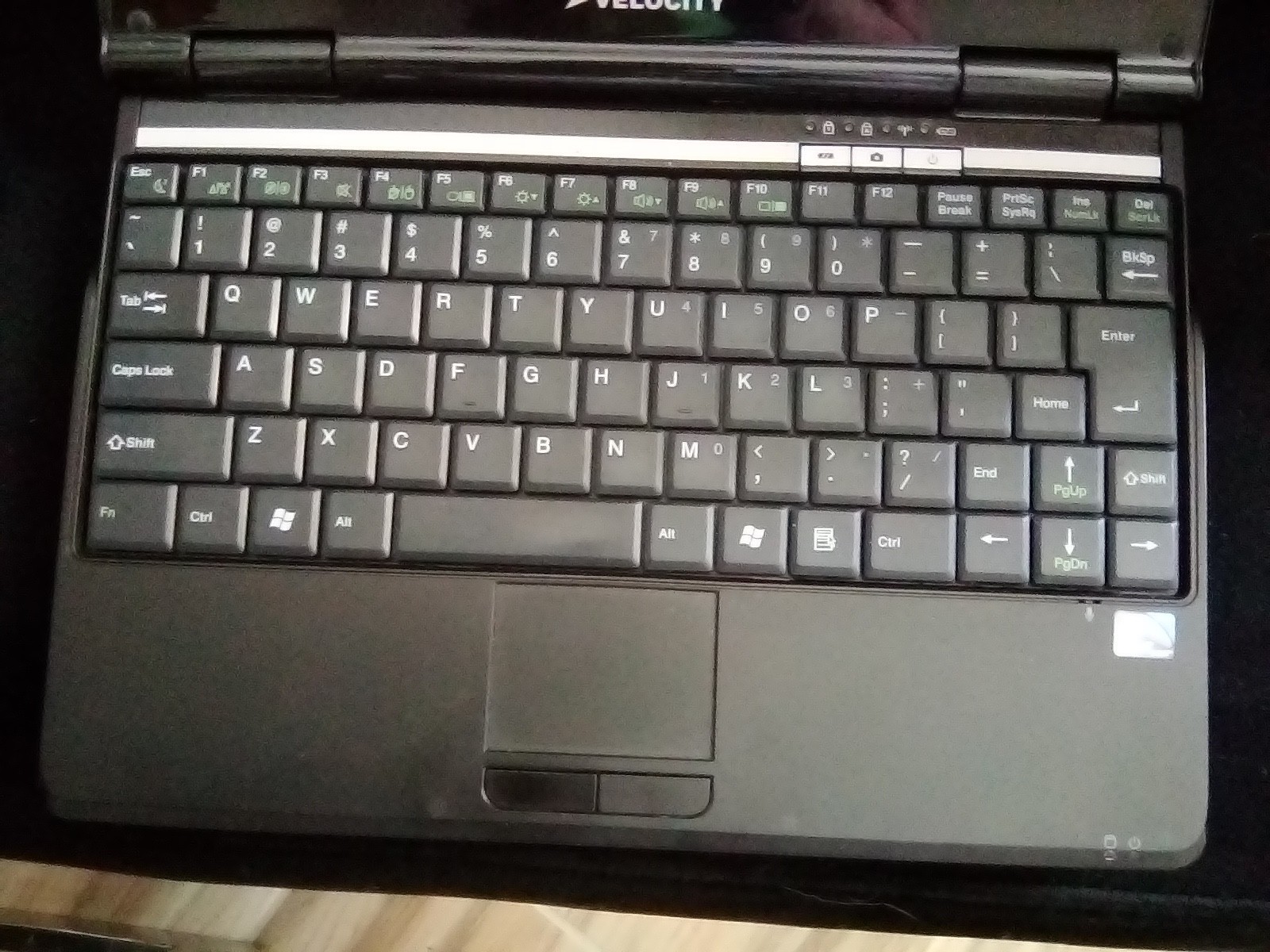 Velocity notebook A82, color red, used and fully operational, with charger