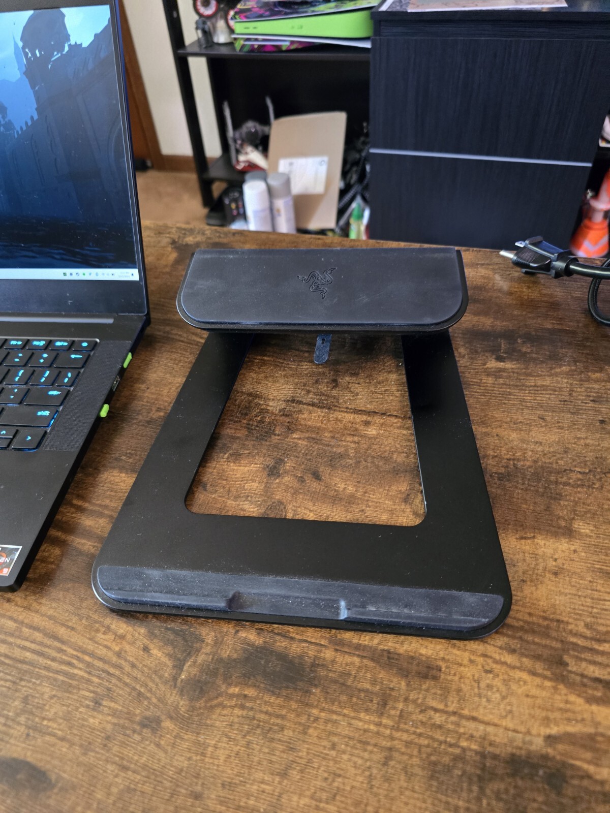 black Razer 14″ Gaming Laptop with razer rgb laptop stand and power supply unit