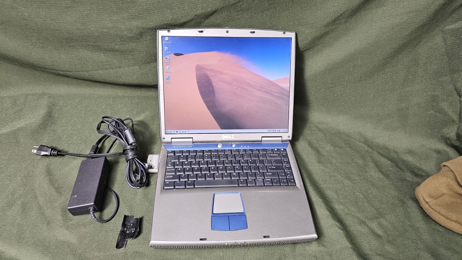 (2) DELL Inspiron 1100 Laptops 1 good battery, no hard drive, both work lot of 2