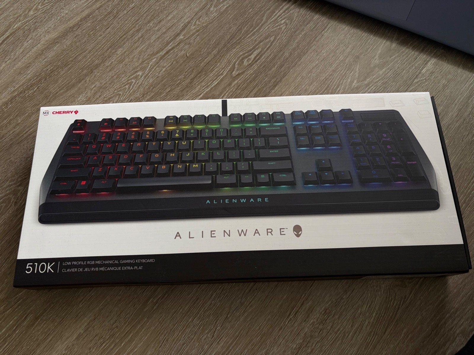 Alienware laptop, gaming monitor, mouse, keyboard, headset and backpack.