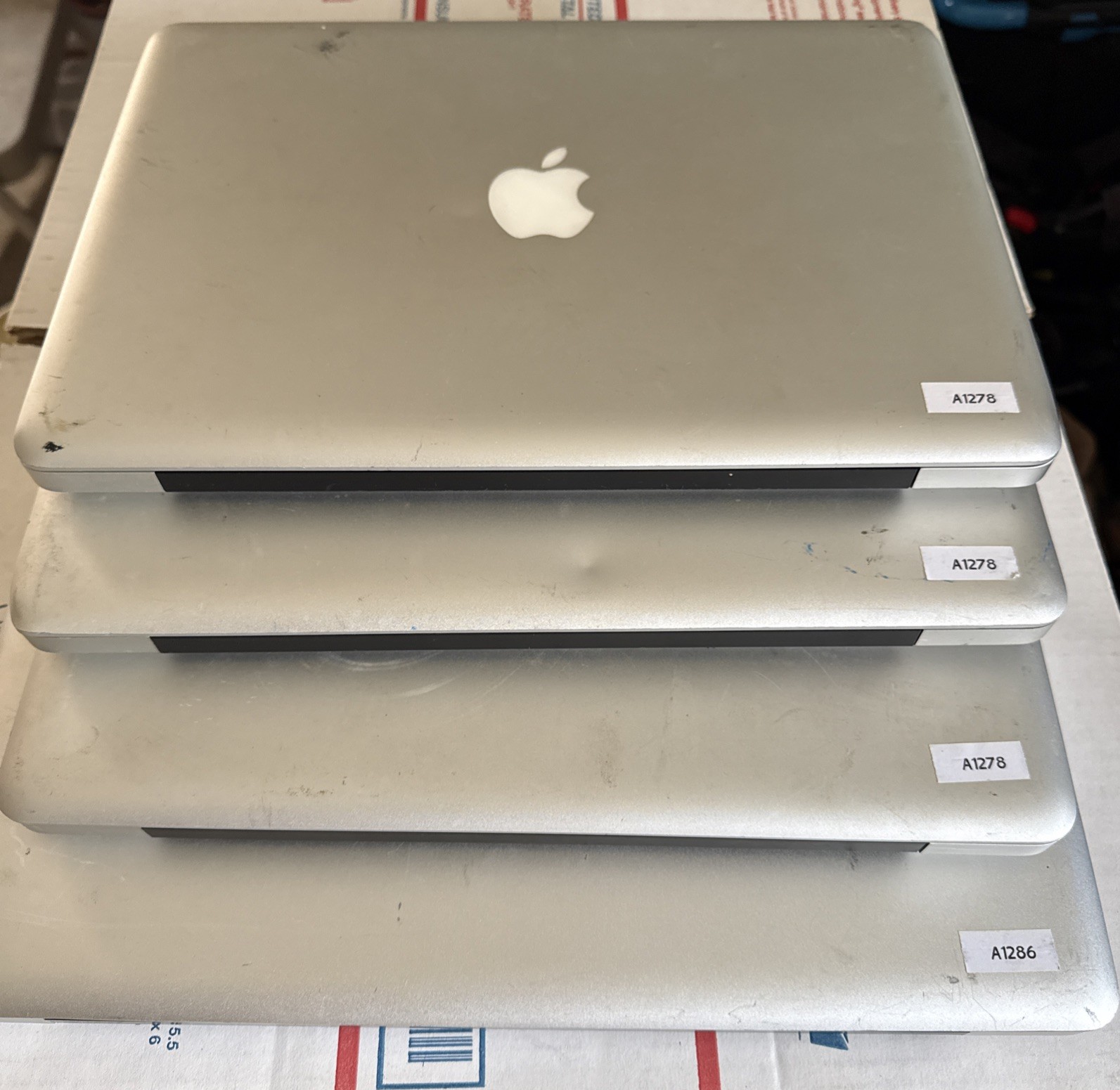 Lot of (4) Apple MacBook Pro (1) A1278 & (3) A1286 Poor condition — 4- PARTS