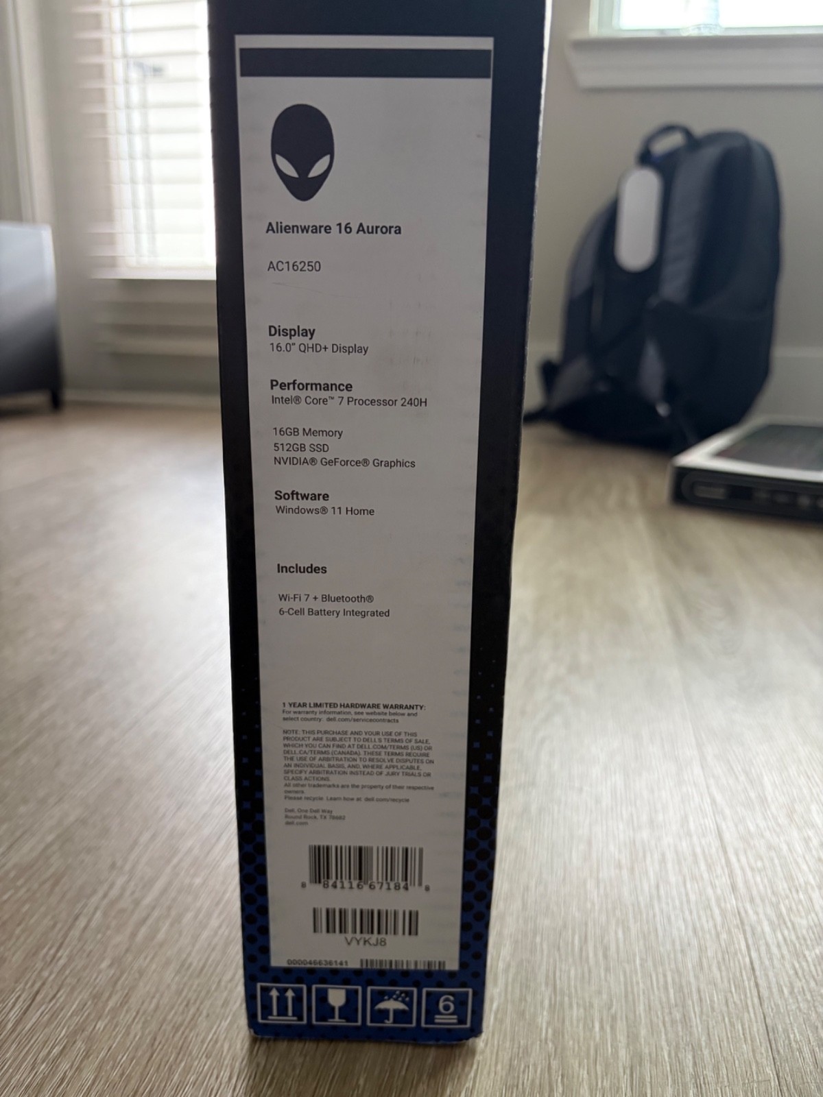 Alienware laptop, gaming monitor, mouse, keyboard, headset and backpack.
