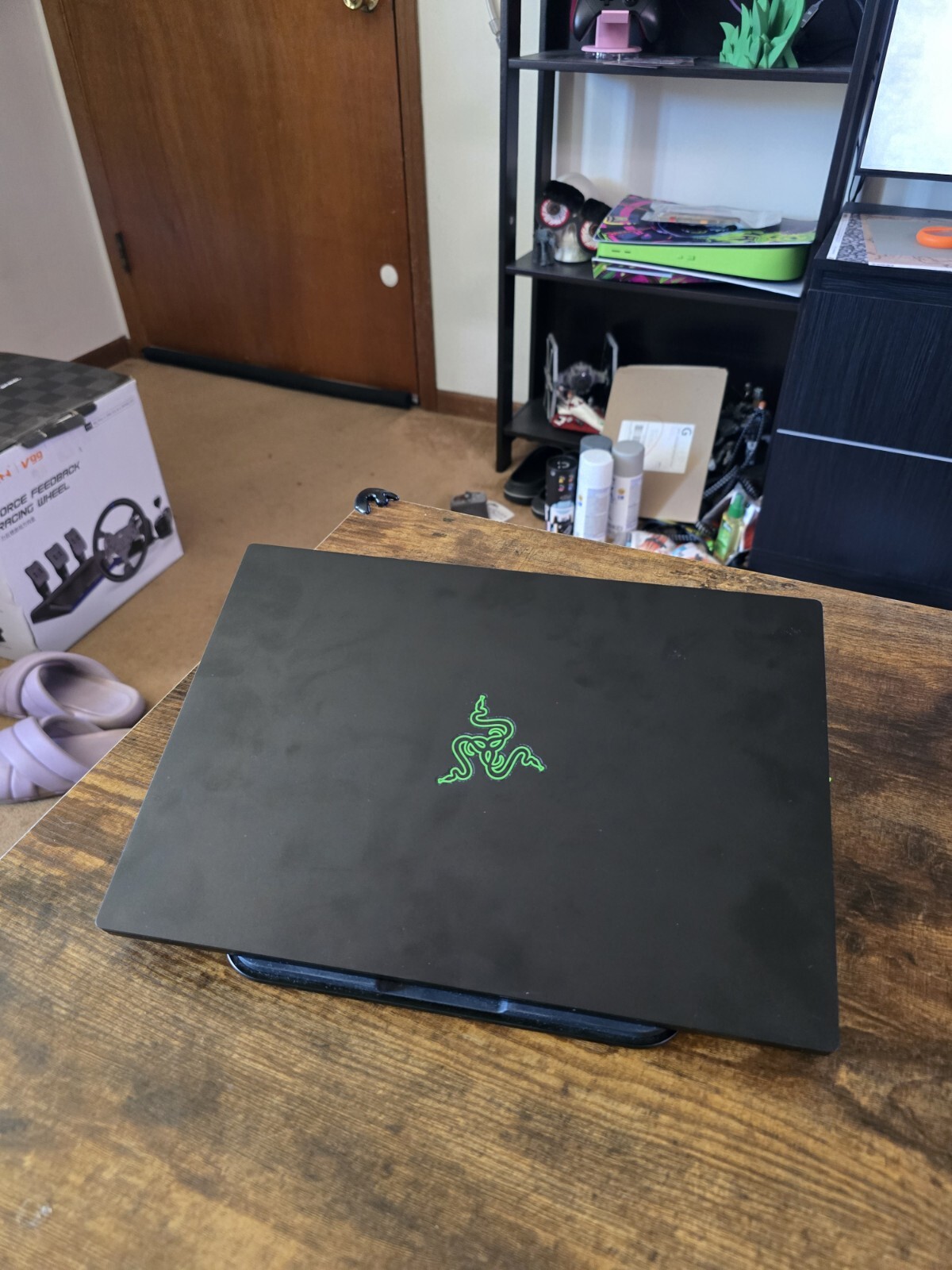 black Razer 14″ Gaming Laptop with razer rgb laptop stand and power supply unit