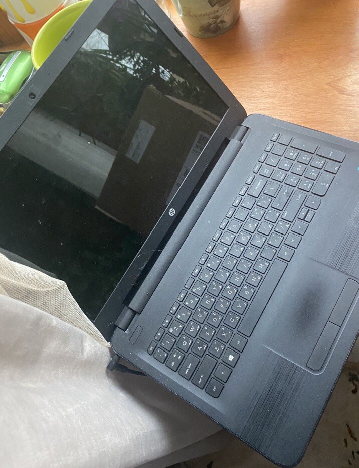 Black HP laptop (only Comes With One Part Of The Charger )