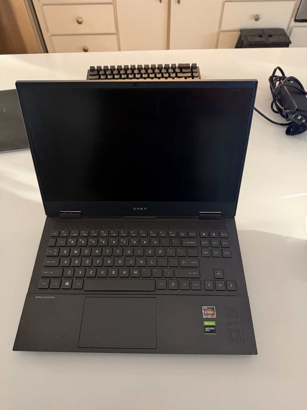 Omen 15 laptop with Razer Mouse, Razer Mousepad, Razer Keyboard, and charger.