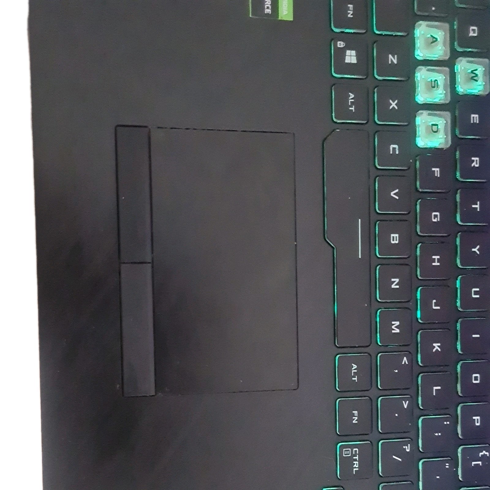 ASUS ROG Strix G G731GU And Nintendo Switch with joycons and one controller