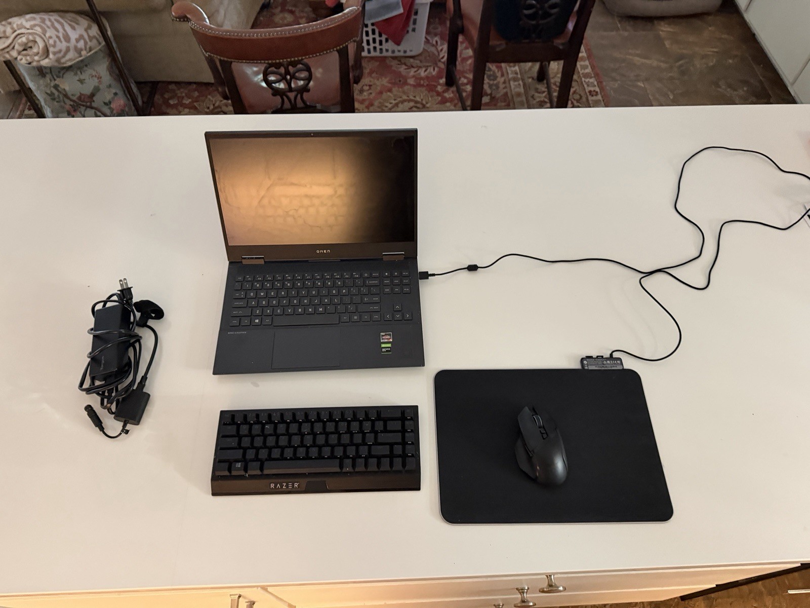 Omen 15 laptop with Razer Mouse, Razer Mousepad, Razer Keyboard, and charger.