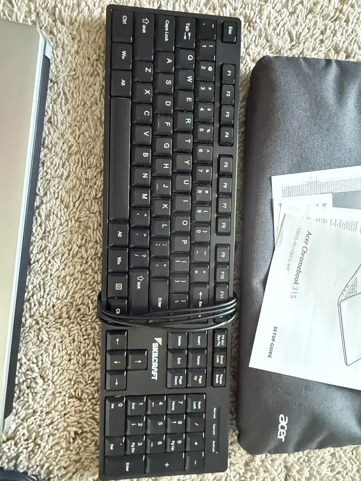 Acer Chromebook 315 with computer sleeve, charger, included a Skilcraft keyboard