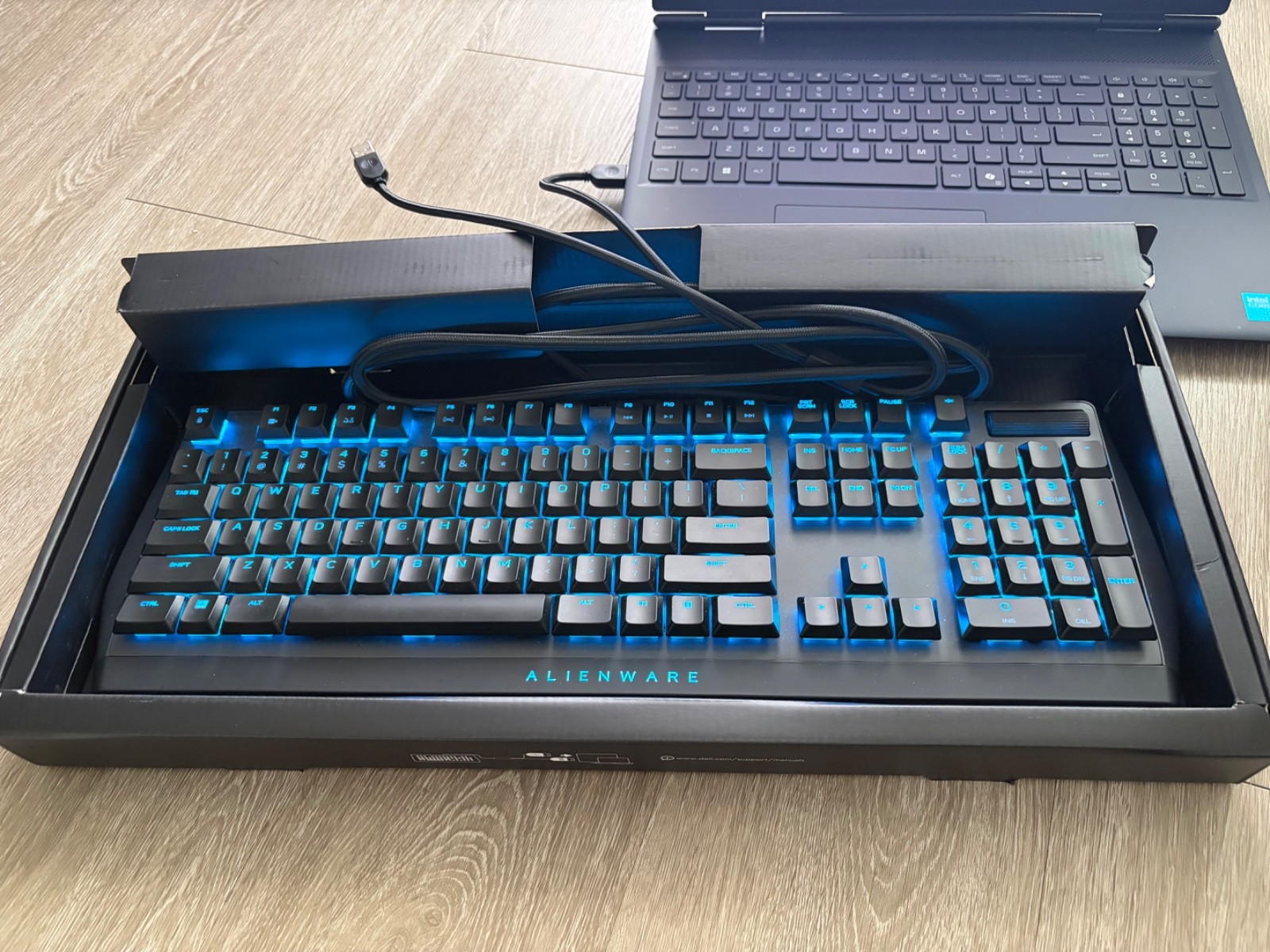 Alienware laptop, gaming monitor, mouse, keyboard, headset and backpack.