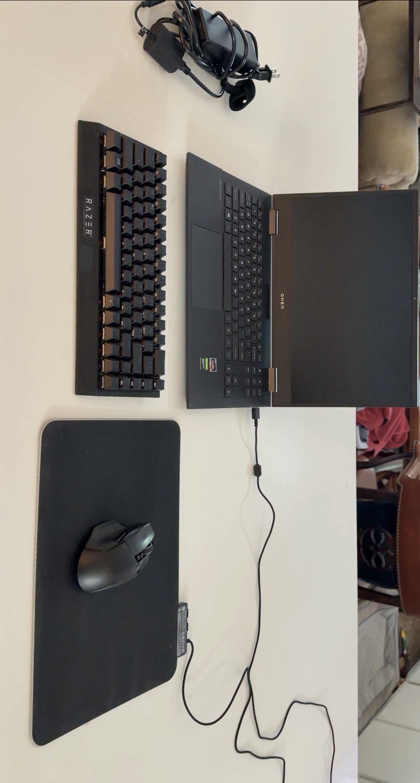 Omen 15 laptop with Razer Mouse, Razer Mousepad, Razer Keyboard, and charger.