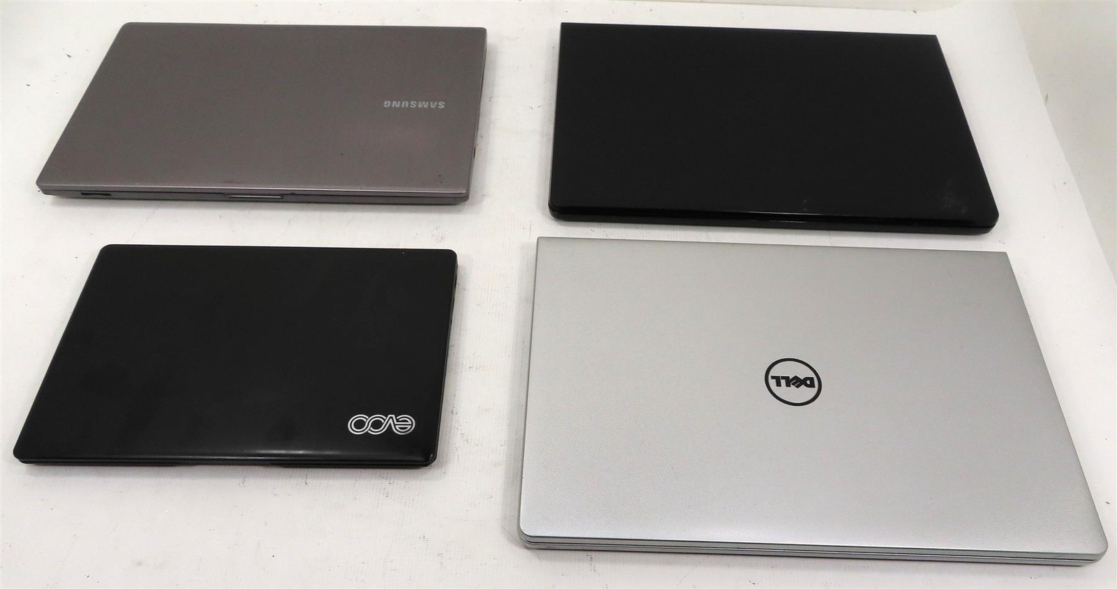 Lot of 4 Mix EVOO, DELL & SAMSUNG No HD & RAM Laptops