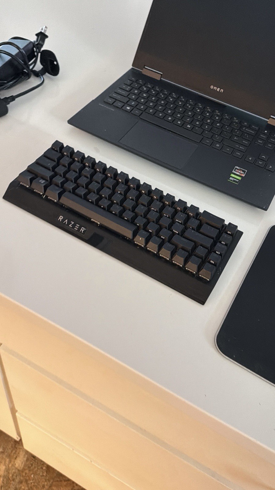 Omen 15 laptop with Razer Mouse, Razer Mousepad, Razer Keyboard, and charger.