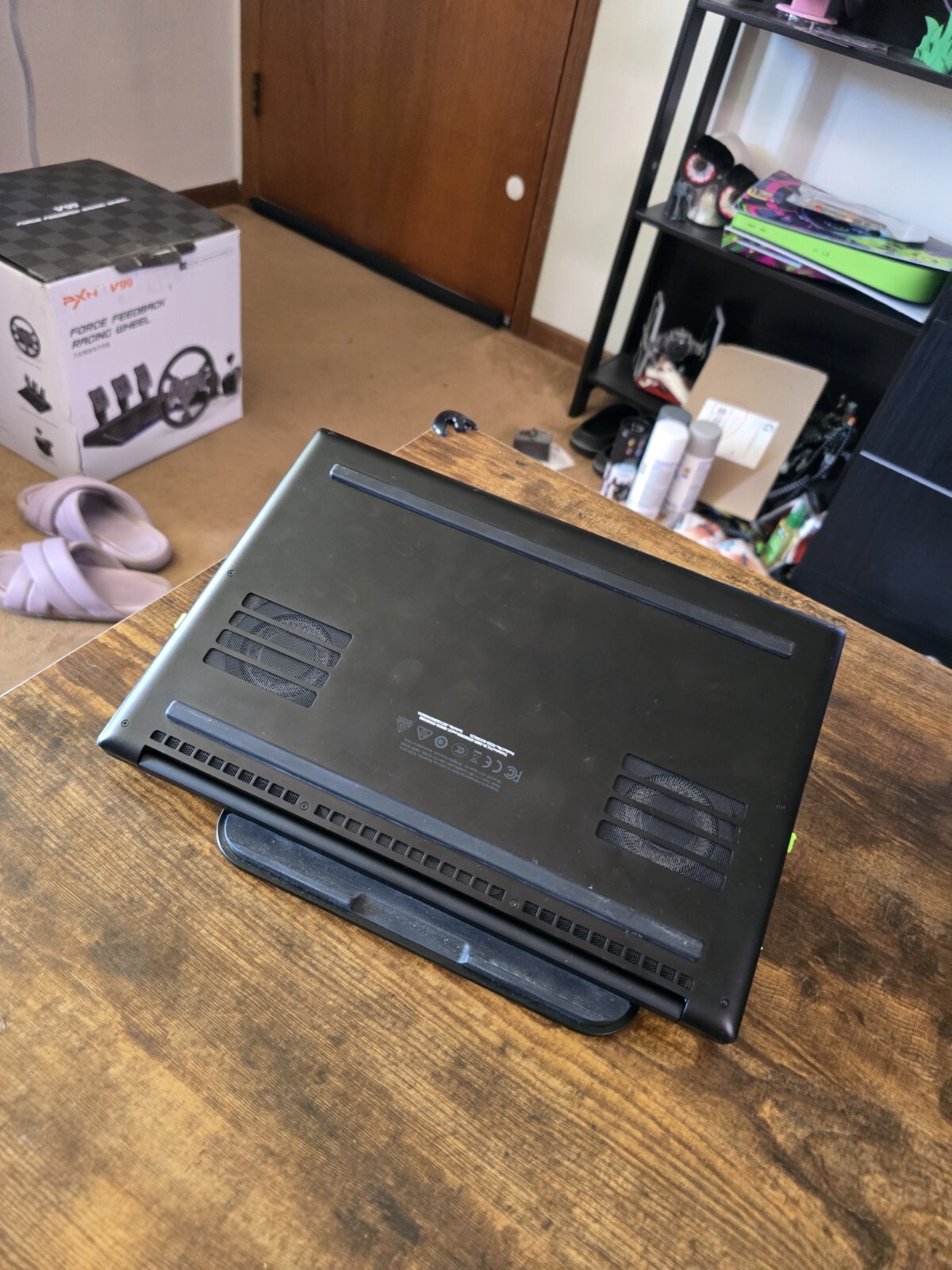 black Razer 14″ Gaming Laptop with razer rgb laptop stand and power supply unit