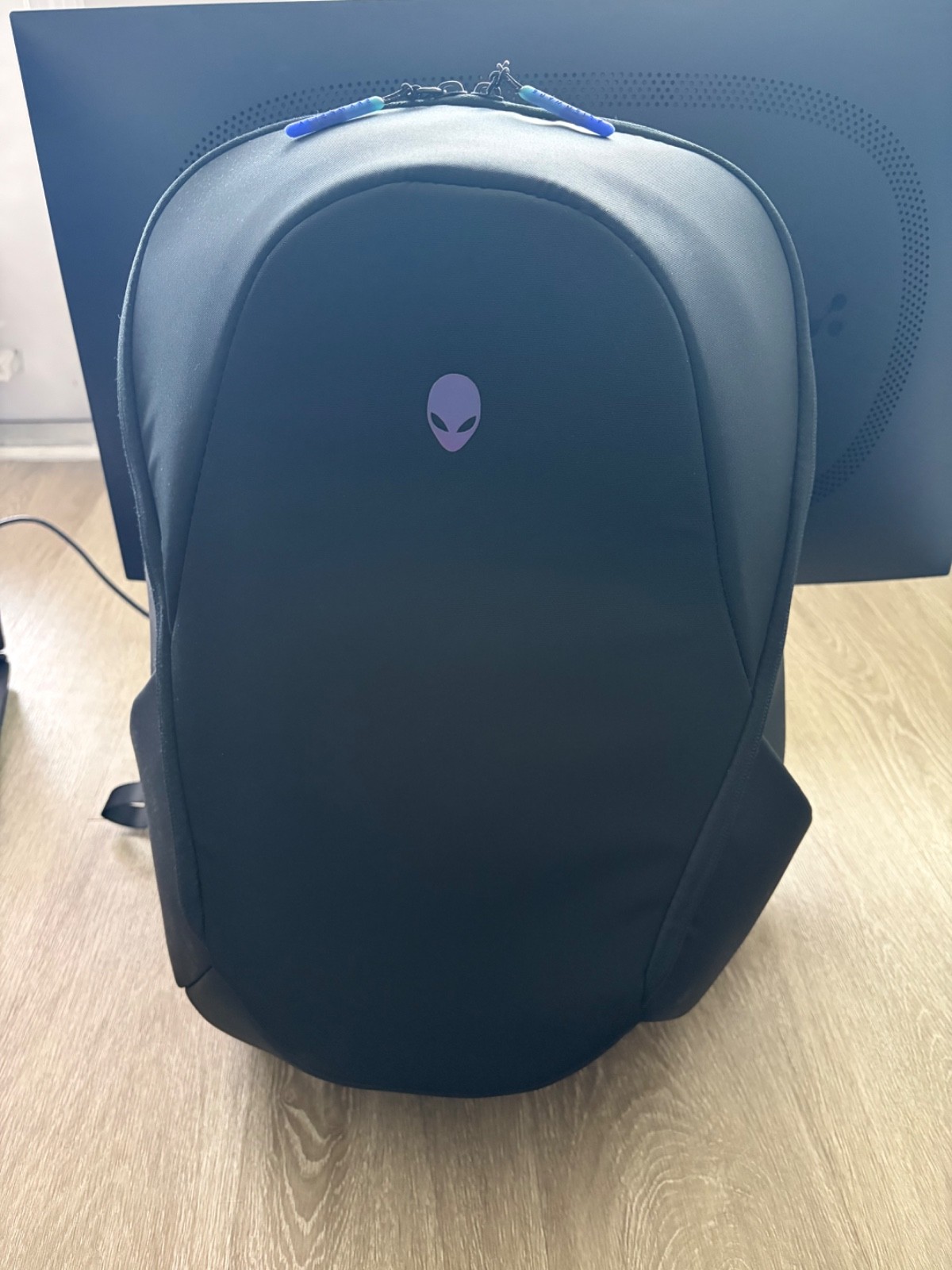 Alienware laptop, gaming monitor, mouse, keyboard, headset and backpack.