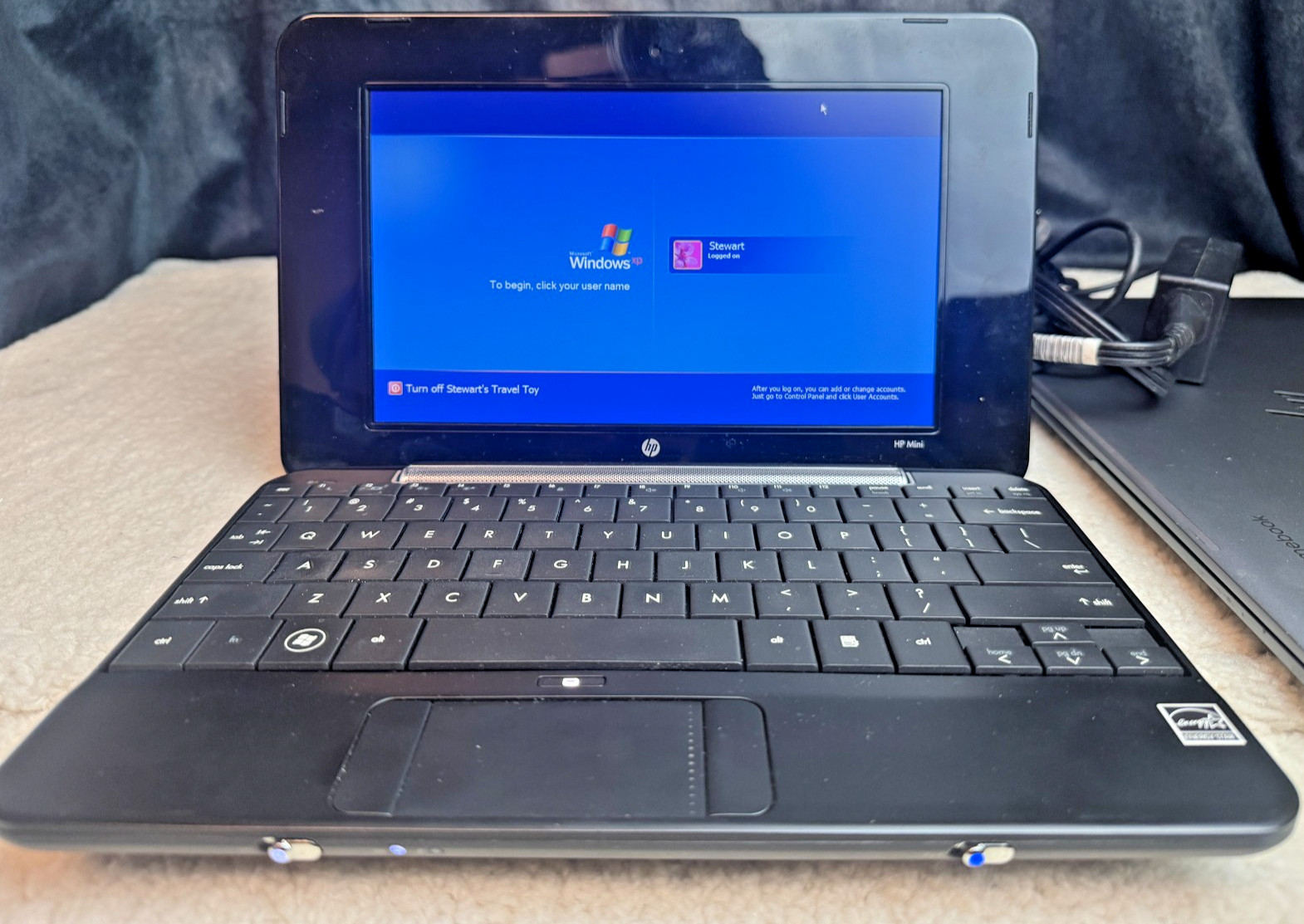Pre-owned HP Mini netbook in working condition, powers on and boots to Windows X