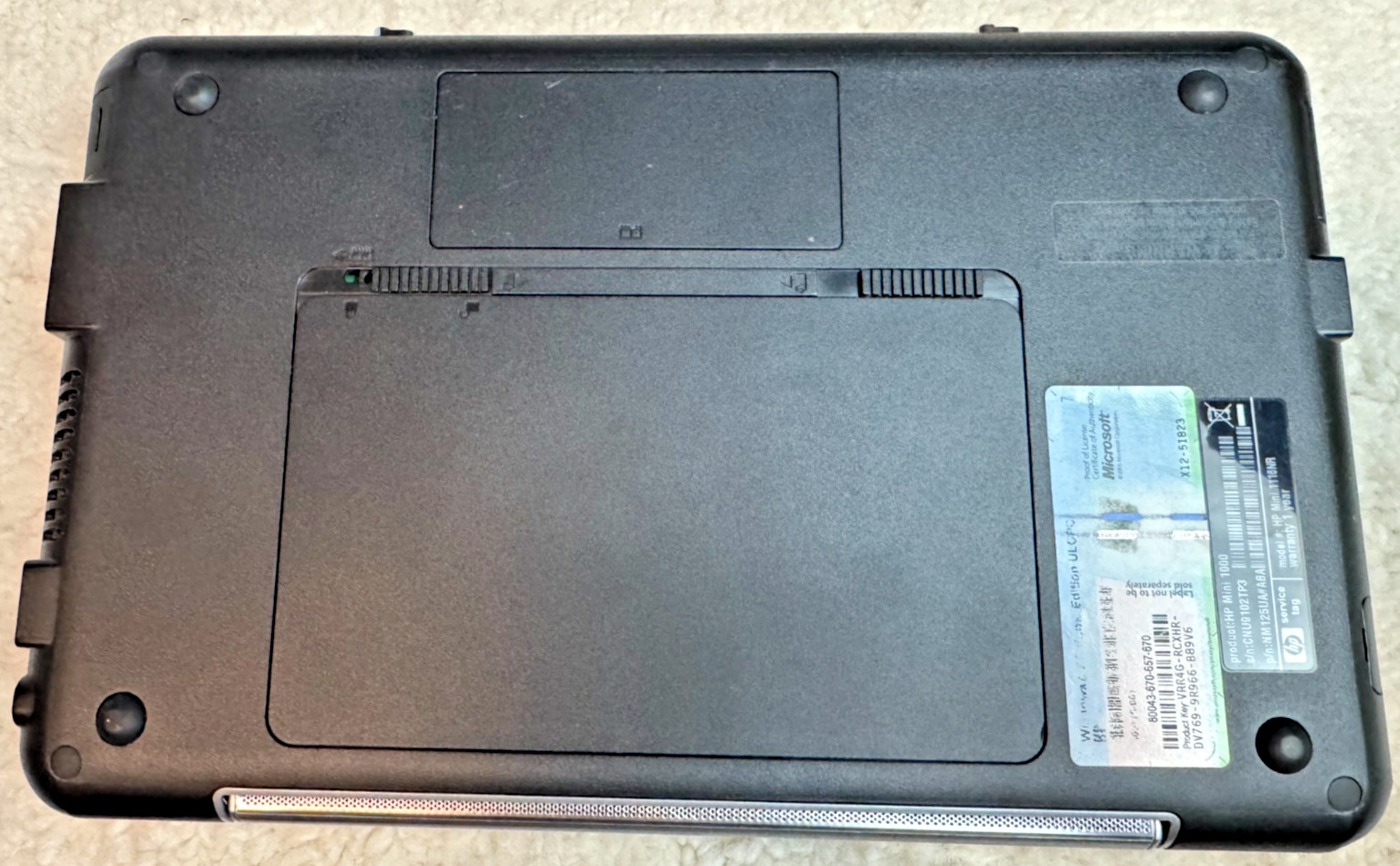 Pre-owned HP Mini netbook in working condition, powers on and boots to Windows X