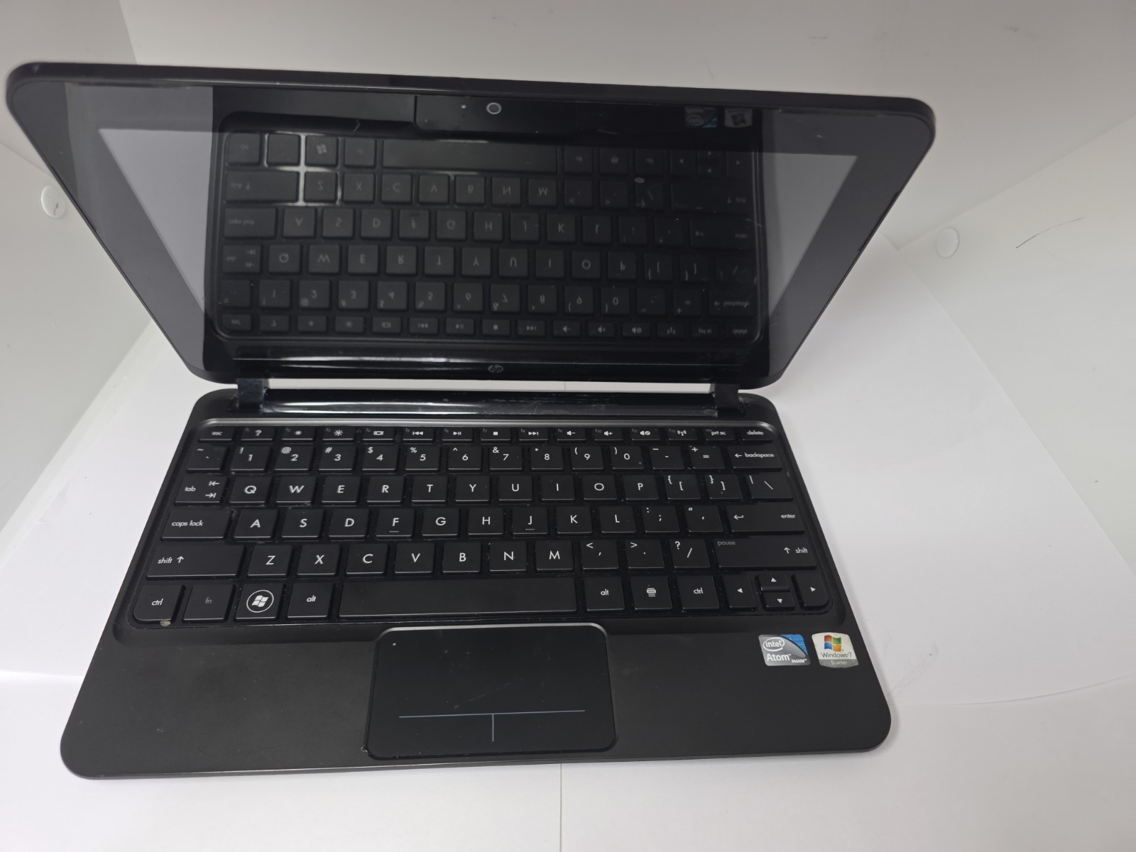 Functional HP Mini laptop. Has scratches and scuffs on screen. For Parts.