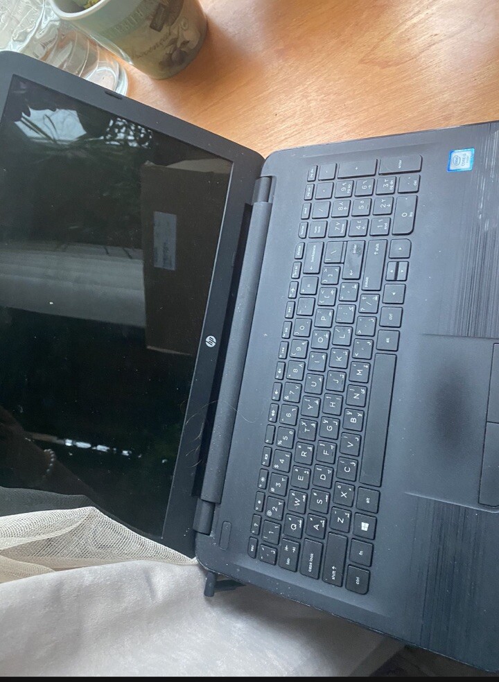 Black HP laptop (only Comes With One Part Of The Charger )