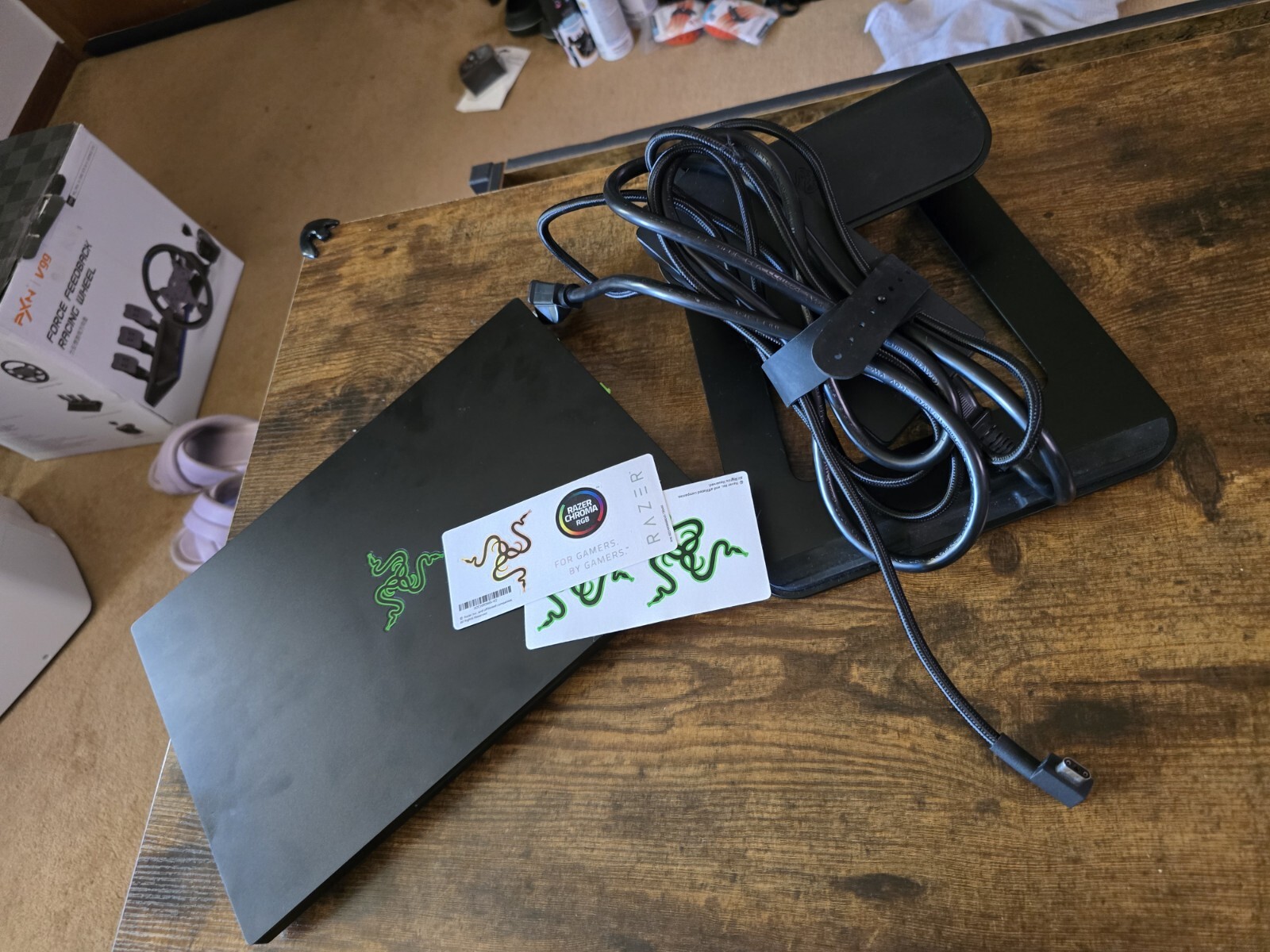 black Razer 14″ Gaming Laptop with razer rgb laptop stand and power supply unit