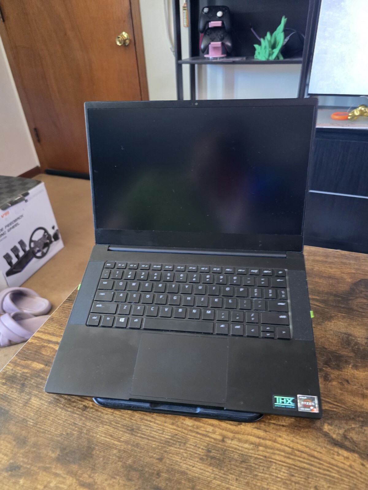 black Razer 14″ Gaming Laptop with razer rgb laptop stand and power supply unit