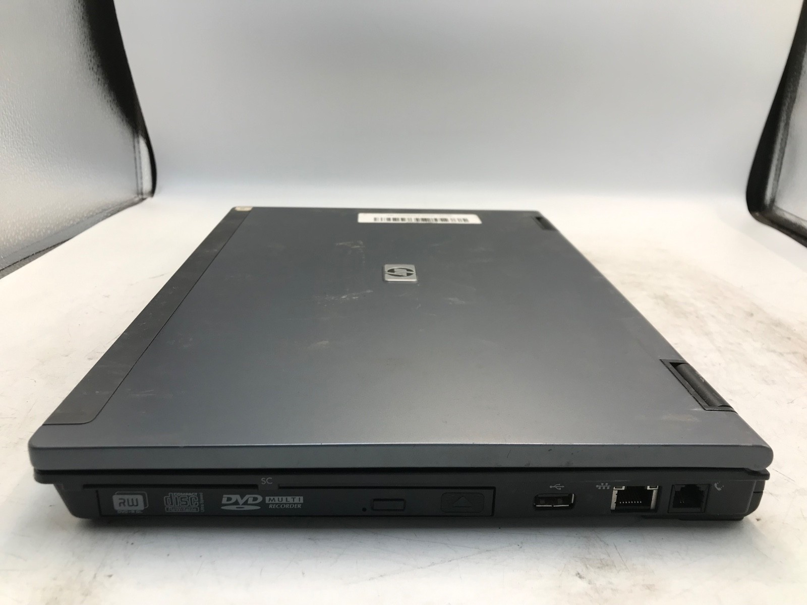 HP Compaq 6910p Intel Core 2 Duo 2.1GHz 14″ NO HDD-BOOTS BIOS, BAD LATCH-MZ